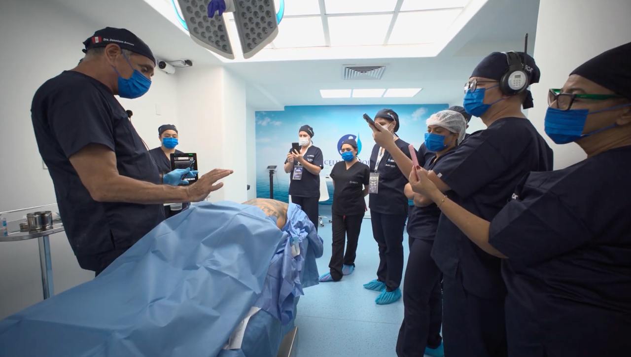ISSCA physicians in scrubs during a hands-on ultrasound practice session